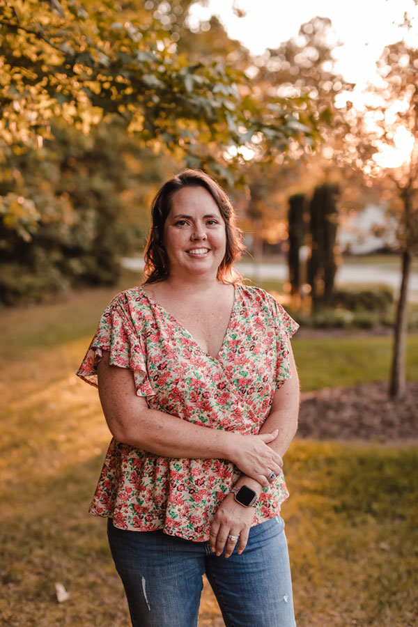 Erica Lawson, REALTOR® smiling and posing for a picture outside