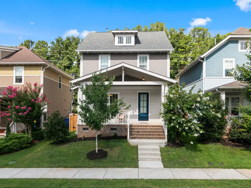 Two story home with a front porch that shows the type of homes for sale in Newport News, Virginia.